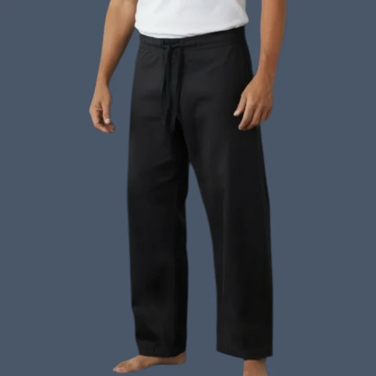 Front view of man wearing black 12oz canvas karate pants
