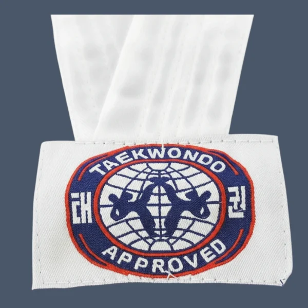 ITF logo Front view of man wearing V neck Taekwondo uniform.