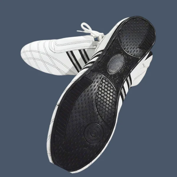 PSLS53_Tkdlthrshoessole3 Image shows black sole of martial arts shoes.