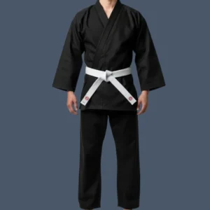 Image shows front view of man wearing black karate uniform with a white belt.