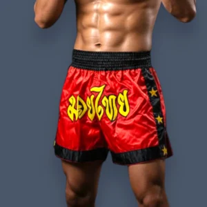 Front view of Muay Thai shorts on a fit man