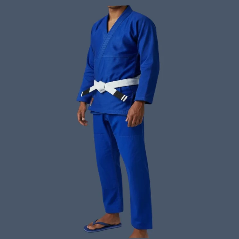 Image shows side front view of man wearing a blue BJJ gi