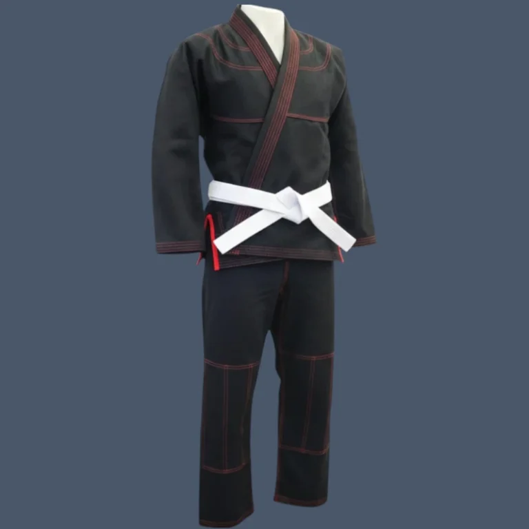 Image shows front view black BJJ gi with a red trim.