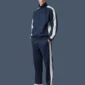 Side front image of unisex tracksuit, modelled by a male.