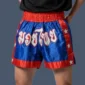 Man wearing Thai shorts made in polyester silk fabric.