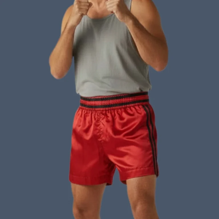 Front view of man wearing red kickboxing shorts
