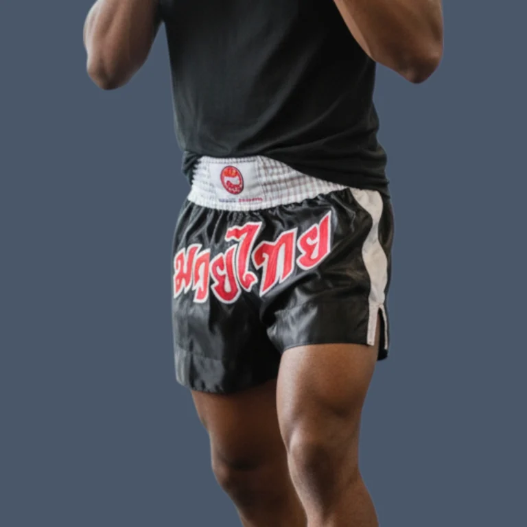Fit man wearing Thai training shorts.