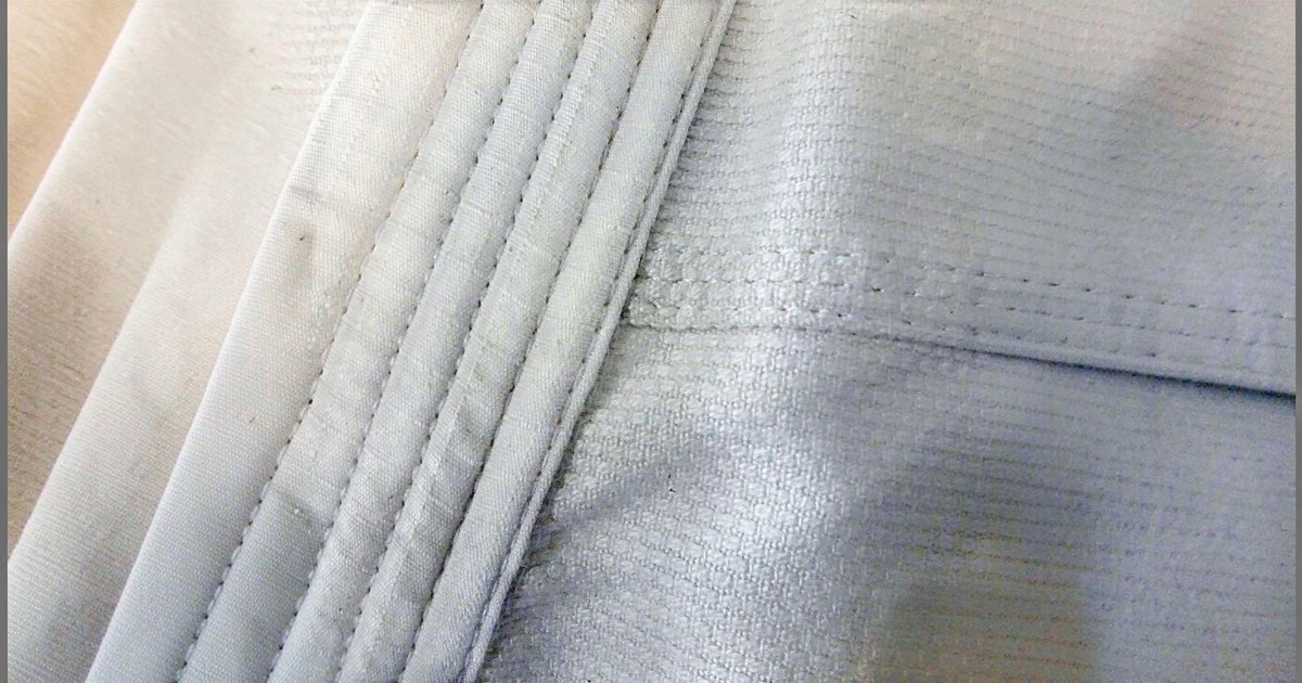 Image shows closeup of weave coomonly used in making BJJ gi's