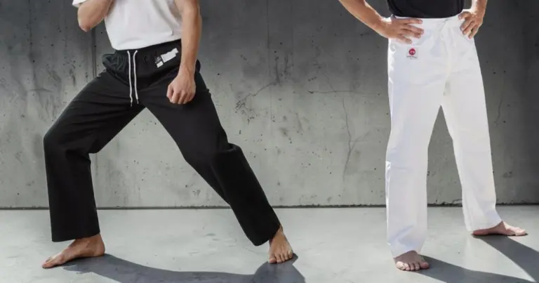 Image shows front view of male modelswearing karate pants