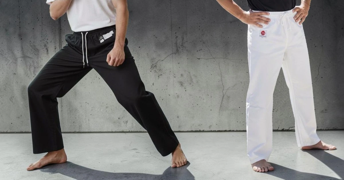 Image shows front view of male modelswearing karate pants