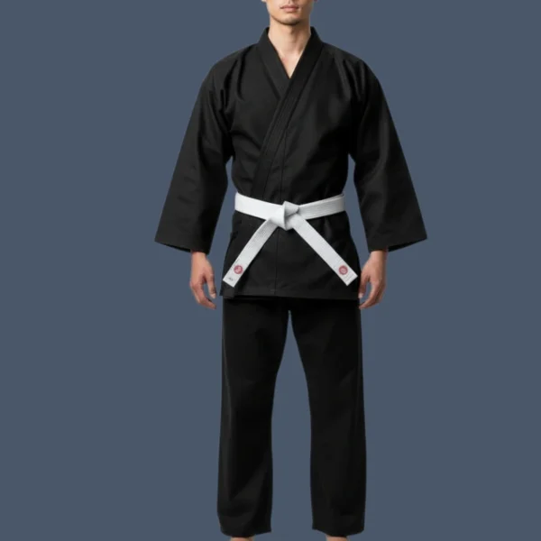 Front view of man wearing black karate uniform.