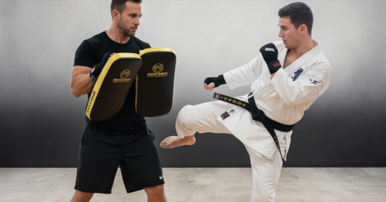 Trainer holding multipurpose pads for student training