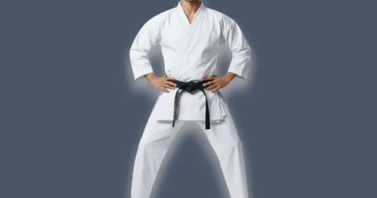 Image shows front view of male wearing European cut karate uniform