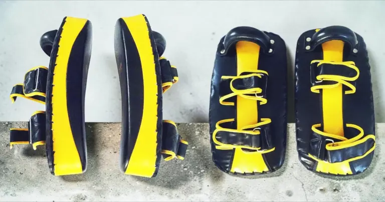 Image shows side and back views of Muay Thai kicking shields