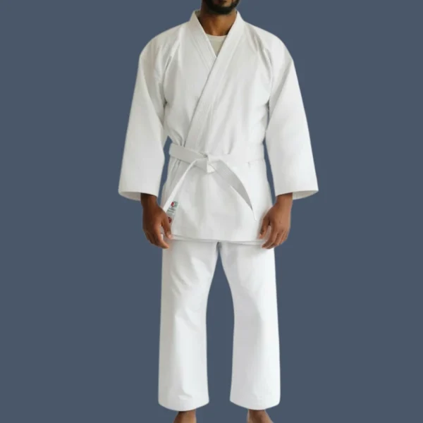 10ozpolycotton-male Man wearing a white karate uniform made in 10oz polyester and cotton fabric.
